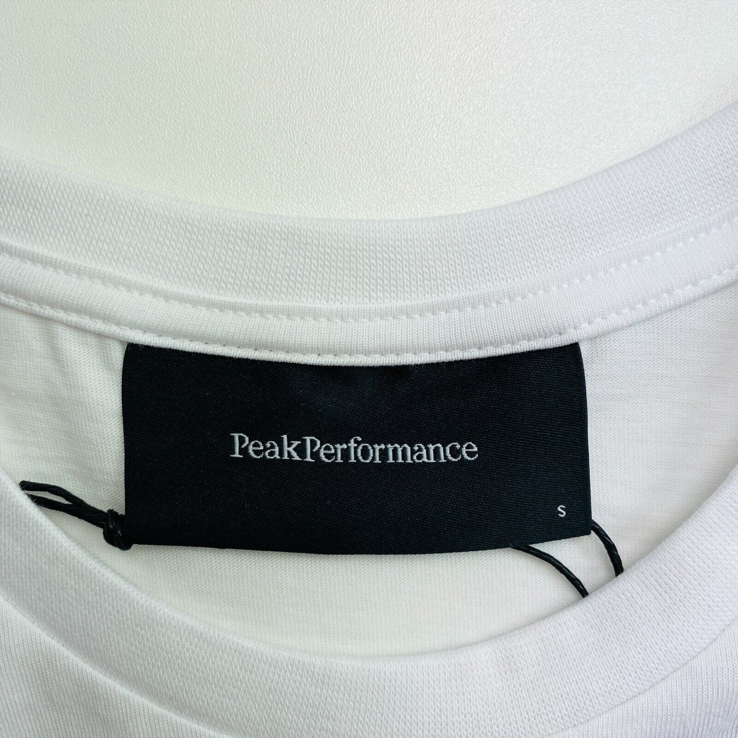 Peak Performance White Ground Logo T Shirt Size S