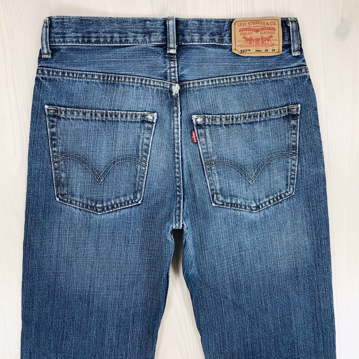 Vintage Levi's 527 Boys Blue Regular Bootcut Fit Ripped Jeans 16 Reg / W28 L28